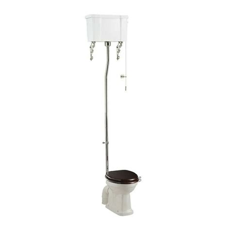 A White Toilet Sitting Next To A Metal Pole