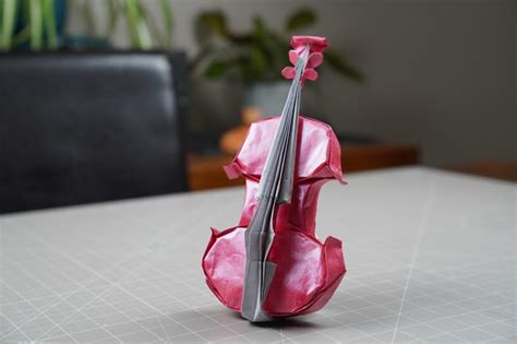Here Is An Origami Violin That I Made From A Uncut Rectangle Length