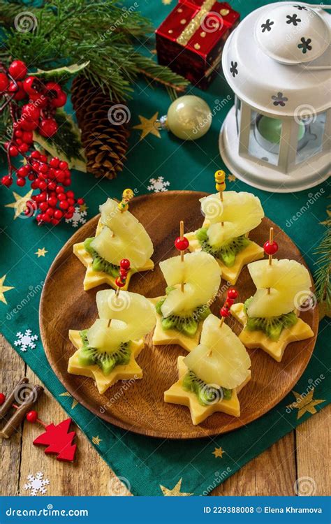 Festive Snack of Canapes on the Christmas Table. Fruit Canapes with ...