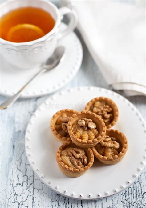 Tea and Tarts with Butter Cream and Walnuts Stock Image - Image of ...