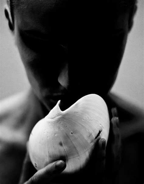 Black And White Photograph Of A Man Holding An Onion In His Hands With