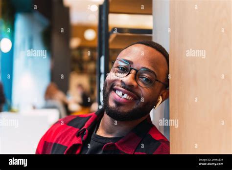 Portrait Of Smiling Bearded African American Male In Red Checkered