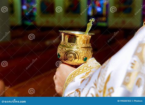 Catholic Priest With Chalice Cup During Consecration Ceremony Stock