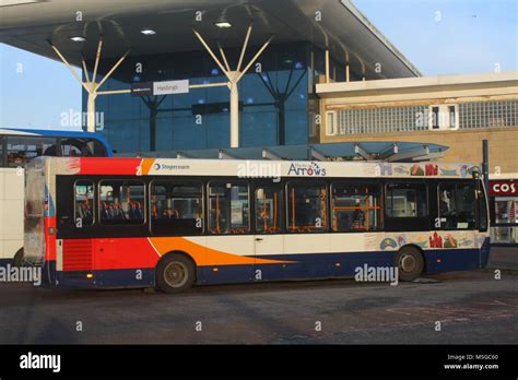 A SUNNY LANDSCAPE SIDE VIEW OF AN ADL ALEXANDER DENNIS ENVIRO 200 BUS