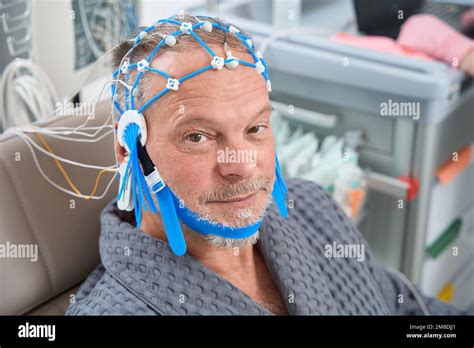 Elderly patient on the diagnostic EEG encephalography procedure Stock ...