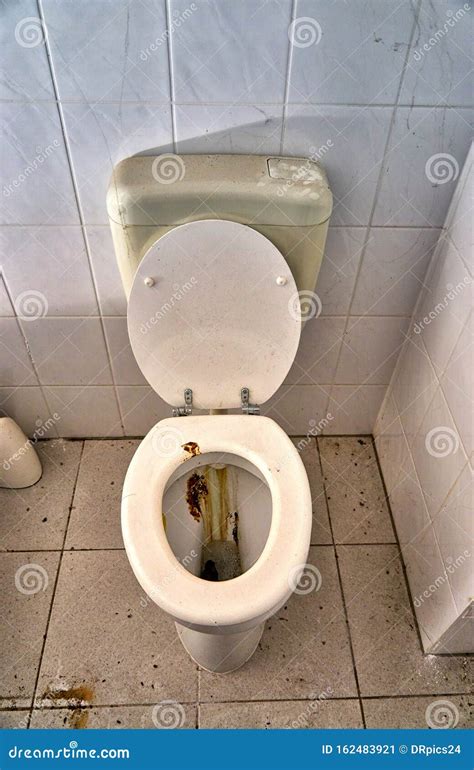 Toilet With Feces And Urine Stained In A Dirty Bathroom Stock Image