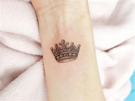 Illustrative Style Crown Tattoo Located On The Wrist