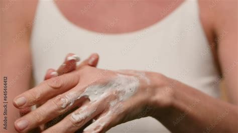 Close Up Female Wrinkled Hands Mature Old Woman Applying Moisturizing