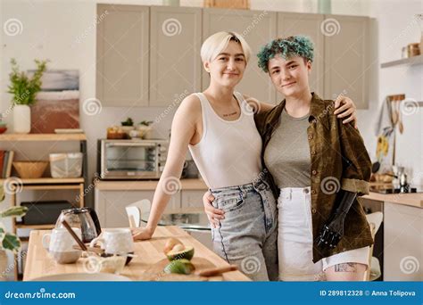 Lesbian Couple Preparing Food In The Kitchen Stock Photo Image Of