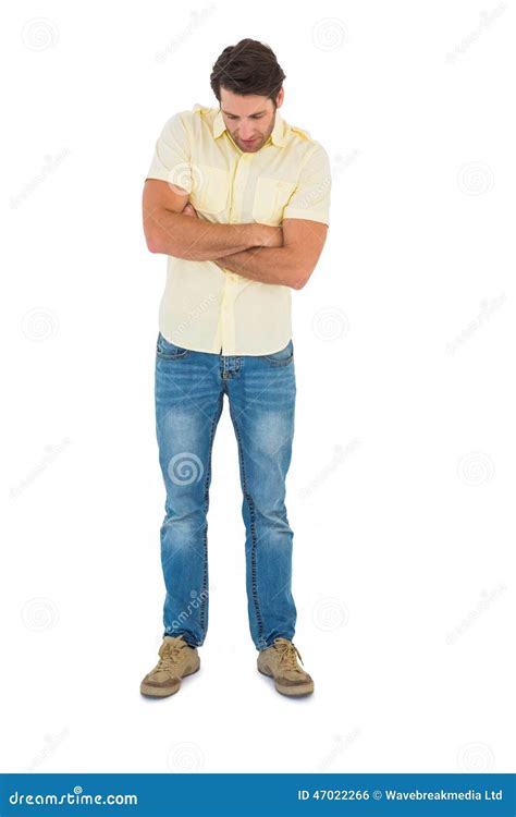 Handsome Man Standing Looking Down With Arm Crossed Stock Photo Image