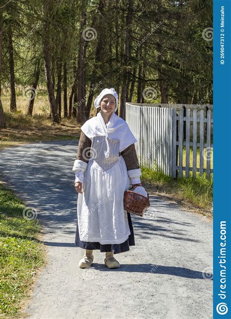 Young Attractive Woman In Old Traditional Clothes Demonstrates Former