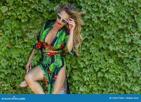 Hot Blonde Brazilian Model Posing Outdoors Against A Field Of Plants Stock Photo Image Of