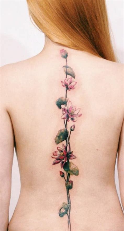 Very beautiful pink colored long tattoo on back - Tattooimages.biz