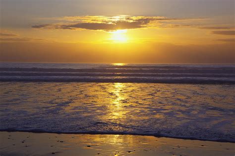 Sunset Over The Pacific Ocean Along The Photograph By Craig Tuttle Fine Art America