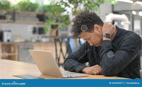 African American Man With Laptop Having Neck Pain Stock Image Image