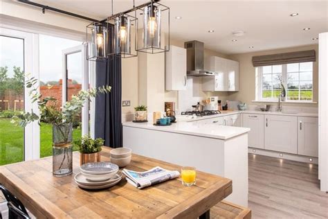 An Open Kitchen And Dining Room Area With Sliding Glass Doors Leading