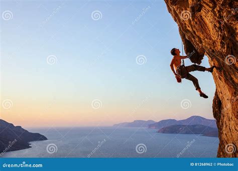 Rock Climber Resting While Climbing Cliff Stock Photo Image Of