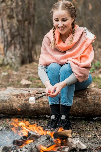 Free Photo Smiley Woman Cooking Marshmallow