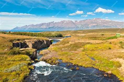 Premium Photo | Iceland landscape with river mountains and bright blue sky