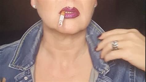 Smoker MILF In Denim With Big Clevage Smokes Close Up Naughty Seductive