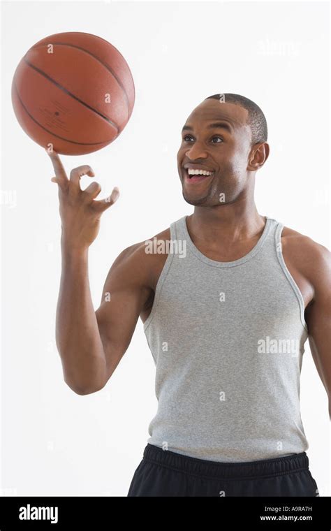 Man Spinning Basketball On Finger Stock Photo Alamy