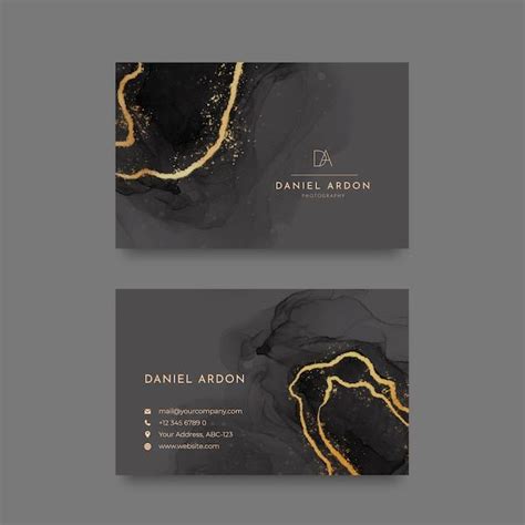 Two Business Cards With Black And Gold Paint