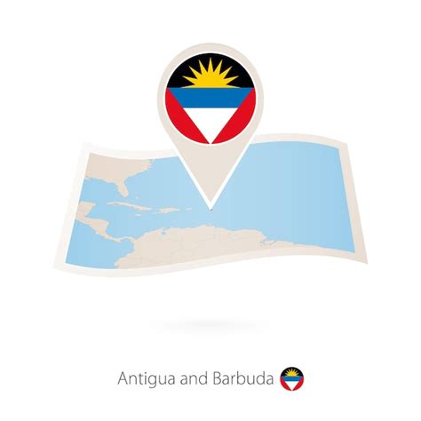 Сложенная бумажная карта антигуа и барбуды с значком флага антигуа и ...
