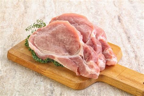 Premium Photo Raw Pork Loin For Coocking Over Board