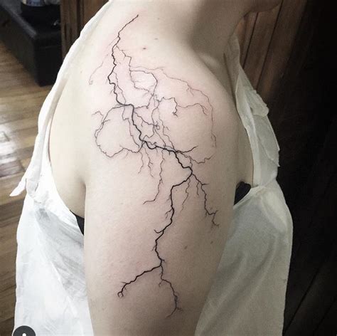 Lightning Bolt Tattoo On Womans Shoulder