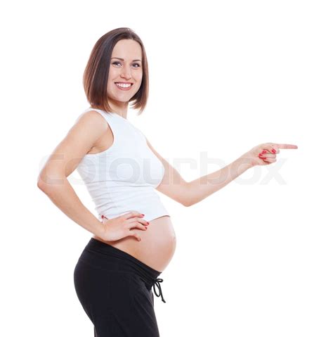 Smiley Pregnant Woman Pointing At Something Stock Image Colourbox