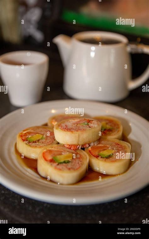 Naruto Maki Roll with Ponzu Sauce at a sushi bar Stock Photo - Alamy