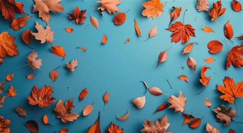 red  blue autumn leaves   teal background premium ai generated