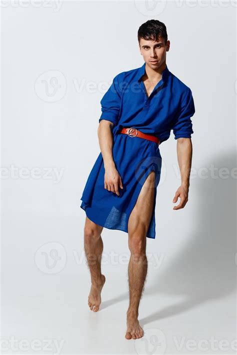 Attractive Man In A Woman S Dress Dancing On A Light Background Gay Model 22521572 Stock Photo