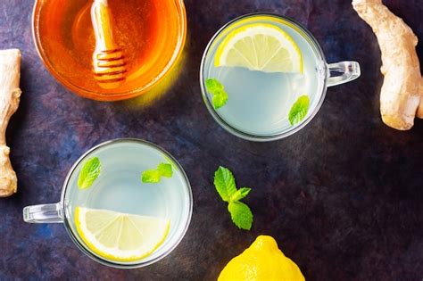 Premium Photo Ginger Tea With Lemon And Mint In Glass Cups