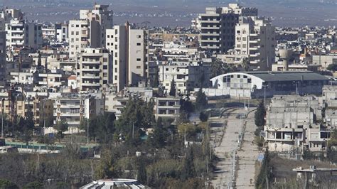 Syrian Rebels Civilians Begin Evacuating Last Homs District Under