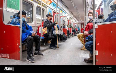 People Wearing Protective Face Masks As They Ride The Toronto Transit