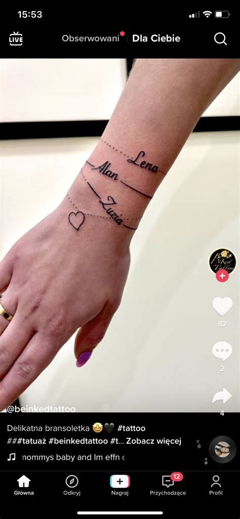 A Person S Hand With A Tattoo On It And The Word Love Written In