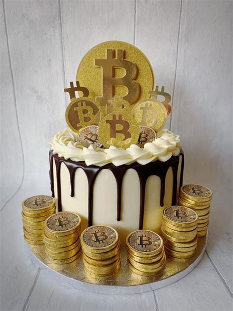 A Cake Decorated With Gold Bitcoins And Chocolate Icing