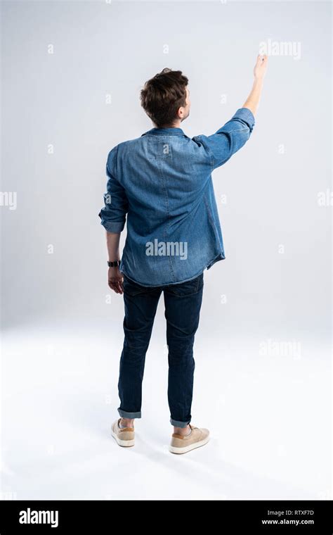 Back View Of A Casual Man Standing On White Background Stock Photo Alamy