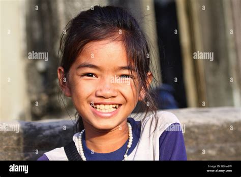 Cute Smiling Young Girl At The Entrance Of Angkor Wat Temple Siem Reap