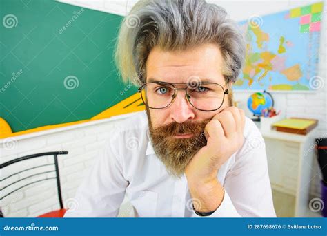 Closeup Portrait Of Thoughtful Teacher In Glasses Male Teacher Or Professor In School Classroom