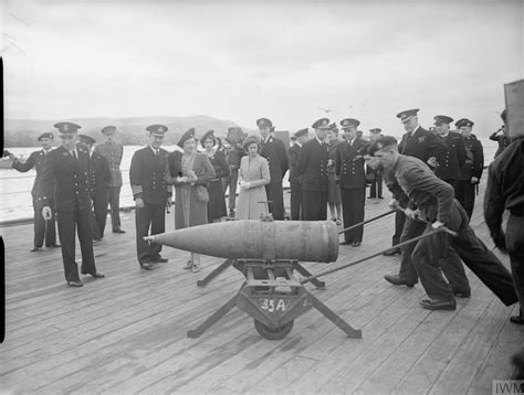 The Royal Party Watch A 14 Inch Shell Being Moved Across The Deck On