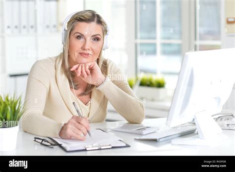 Portrait Of A Mature Woman Using Computer Stock Photo Alamy