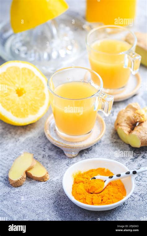 Close Up Of Healthy Ginger Lemon Turmeric Shot Ideal To Boost The