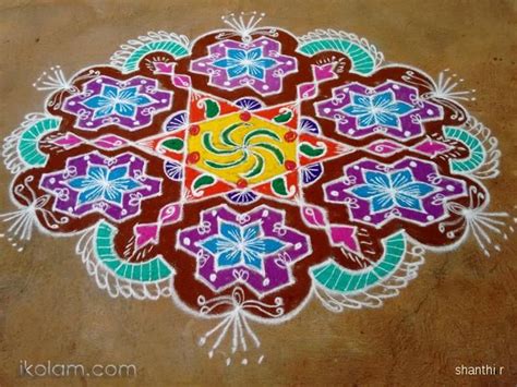 A Colorful Rangdi Design On The Ground