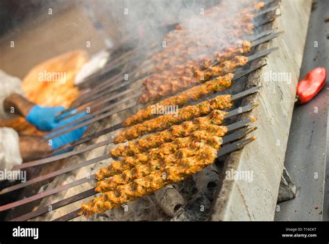 Turkish Adana Urfa Kebab Being Grilled In The View Stock Photo Alamy