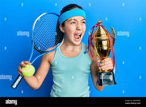 Beautiful Brunette Little Girl Playing Tennis Holding Trophy Angry And