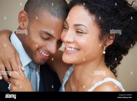 Bride and groom embracing Stock Photo - Alamy