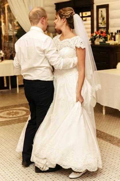 Premium Photo Happy Gorgeous Bride And Stylish Groom Dancing In Rich