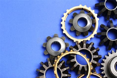 Different Stainless Steel Gears On Light Blue Background Flat Lay